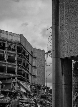 Old concrete office building during demolitionの写真素材