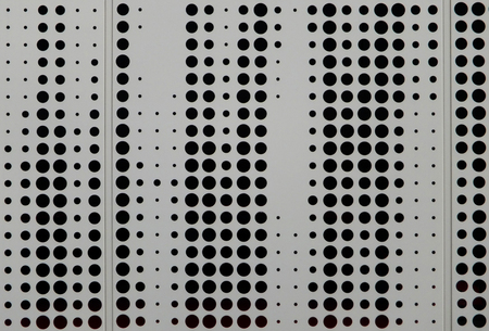 grey metal cladding with circular design