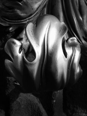 old ornate silver metal door handle with decorative leaf designの写真素材