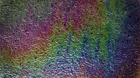 colorful rainbow oil stain on a road background