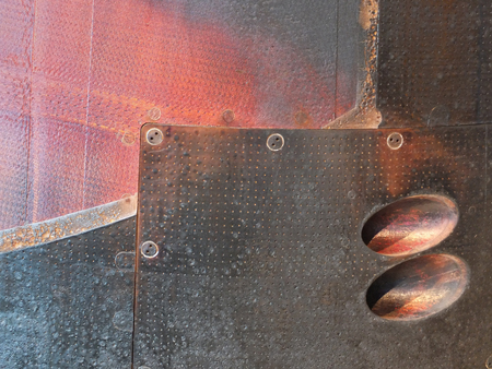 rusted burned steel red and black metal panels on a  used soyuz entry landing capsuleの写真素材