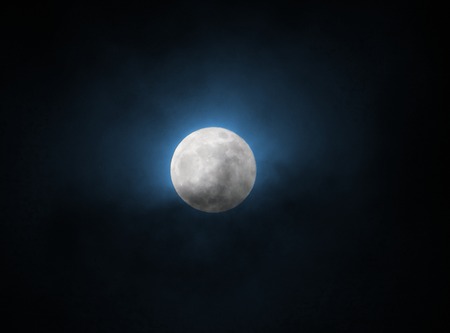 blue glowing full moon at supermoon 31 january 2018 in a black skyの写真素材
