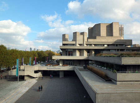 London, England - November 04, 2017: Peple walking along the concourse of the national theatre in London and on the pedestrian south bank of the river thamesのeditorial素材