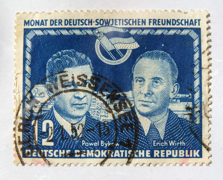 Leeds, England - April 18 2018: An old blue east german postage stamp with an image celebrating german soviet cooperationのeditorial素材