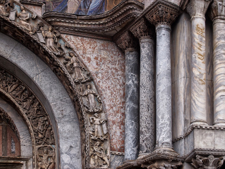 detail of the doorway and marble columns on saint marks cathedral in veniceの写真素材