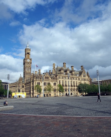 bradford, west yorkshire, united kingdom - 28 may 2019: centenary square in bradford west yorkshire with people sitting and walking past the city hall and magistrates court buildingsのeditorial素材