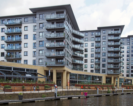 leeds, west yorkshire, united kingdom - 16 july 2019: modern apartment developments and waterside bars around leeds dockのeditorial素材