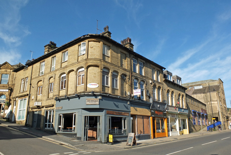 sowerby bridge, west yorkshire, united kingdom - 14 september 2019: shops and buildings on high...