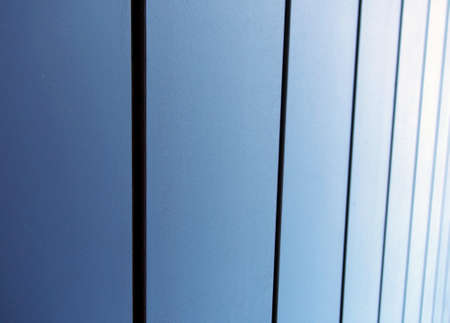 modern textured metallic blue vertical panels architectural abstract backgroundの写真素材