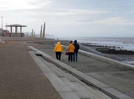 Blackpool, Lancashire, United Kingdom - 6 March 2020: older people in anoraks walking along the...