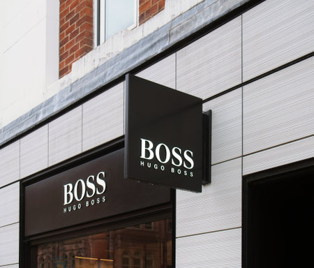 leeds, west yorkshire, united kingdom - 11 may 2021: sign above the entrance of the hugo boss retail...
