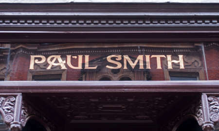 leeds, west yorkshire, united kingdom - 11 may 2021: sign above the entrance of the paul smith...