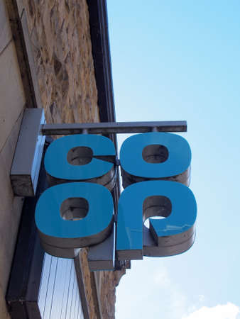 hebden bridge, west yorkshire, united kingdom - 22 may 2021: sign above a coop supermarket in hebden bridgeのeditorial素材