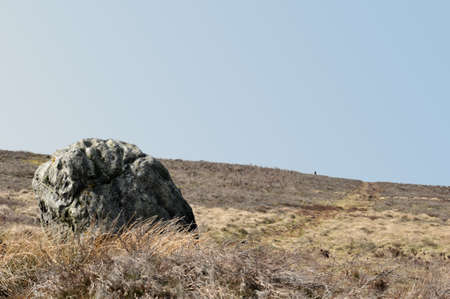 pennine landscape with large old boulder or standing stone on midgley moor in west yorkshireの写真素材
