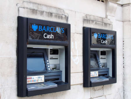 leeds, west yorkshire, united kingdom - 7 july 2021: two ATMs with logo on the wall of a barclays bank in leeds city centreのeditorial素材