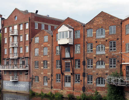 leeds, west yorkshire, united kingdom - 7 july 2021: apartments and bars next to the river aire on...
