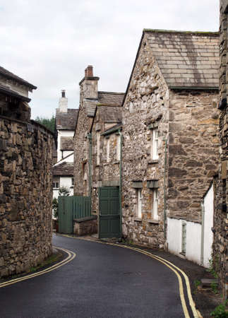narrow street of old houses in the village of cartmel in cumbria