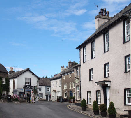 cartmel, cumbria, united kingdom - 16 september 2021: people walking in the street near the village square and shop in cartmel cumbriaのeditorial素材