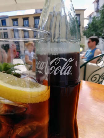 Ciutedella, Menorca, Spain - 2 October 2018 : close up of a bottle of coca cola with text in spanish...