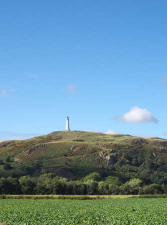 hoad hill an historic 19th century monument in Ulverston with surrounding trees and fieldsの写真素材