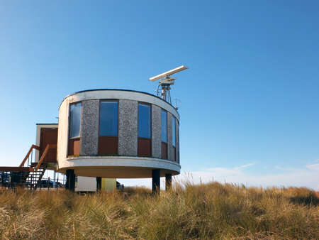 Fleetwood, Blackpool, Lancashire / United Kingdom - 5 March 2022: the coastal radar station in Fleetwood Lancashire, a 1960s concrete brutalist building next to the beachのeditorial素材