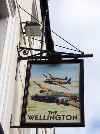 Scarborough, North Yorkshire, United Kingdom - 12 September 2022: sign with world war 2 bomber aircraft over the wellington pub in scarborough yorkshireのeditorial素材