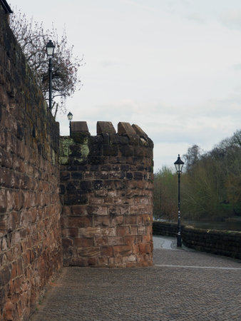 The river Dee in Chester from the riverside walkway along the city wall with trees on the opposite bankの写真素材