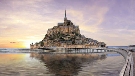 Sunset on Mont Saint Michel in Franceの写真素材