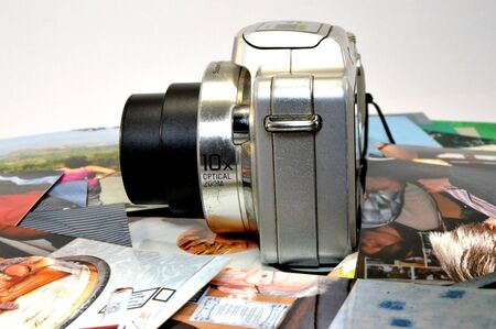 old camera and several photographs.の写真素材