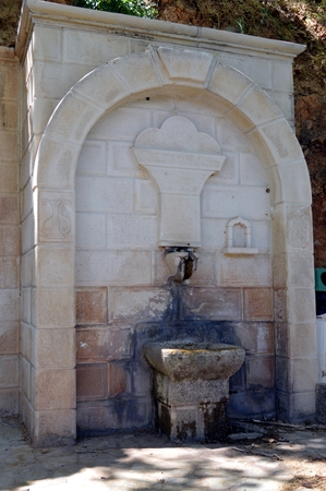Old stone fountain in the campaign on the Cretanの写真素材