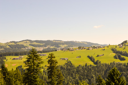 View of a valley and green hills in the Austrian Tyrolの写真素材