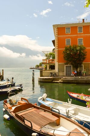 View on the lake of guard and the small port of the city of Limone in Italyのeditorial素材