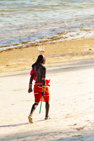 Masai in traditional clothes on Bamburi beach in Mombassa Kenyaの写真素材