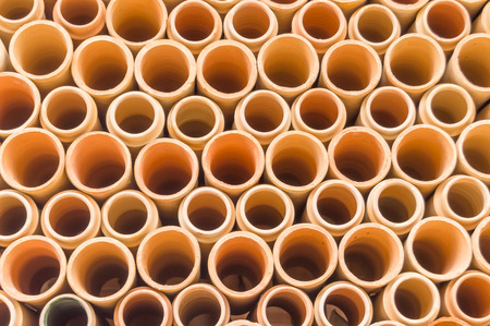 Background of ceramic water downpipes place on each other north of Sicilyの写真素材