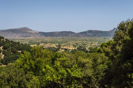 View of the fertile Lassithi Plateau in Crete. Panoramic view of the Lassithi Plateau in Crete, Greeceの写真素材