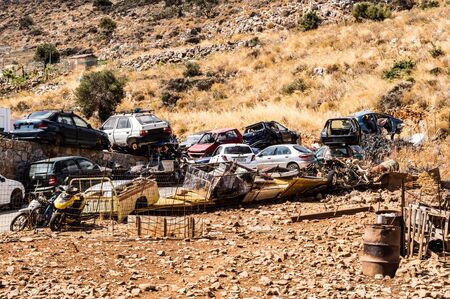 Caste of old cars and motorcycles in the mountains of the island of Crete in Greece