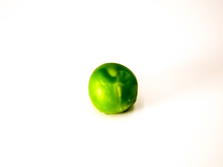 Green peas on a white backgroundの写真素材