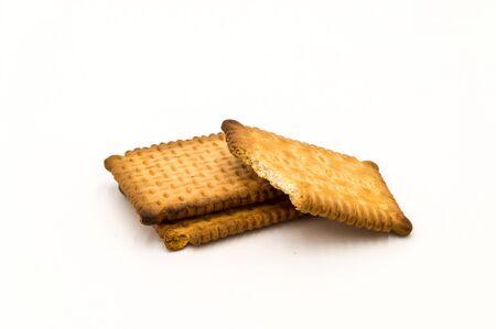 Small butter cookies close up front view on a white backgroundの写真素材