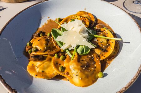 Rabbit ravioli with mushroom sauce and its rapeseed parmesan cheese on the island of Maltaの写真素材