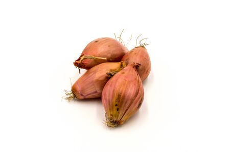 Vegetables: several shallots isolated on white backgroundの写真素材
