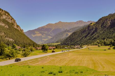 Austrian countryside and mountains under the sunの写真素材