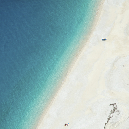 Aerial view of the white sands and azure sea of Kefalonia's Myrtos beach, one of the most idyllic beaches of the Greek islands.の写真素材