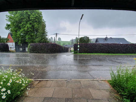 Shelter at a bus station by heavy summer rainの写真素材