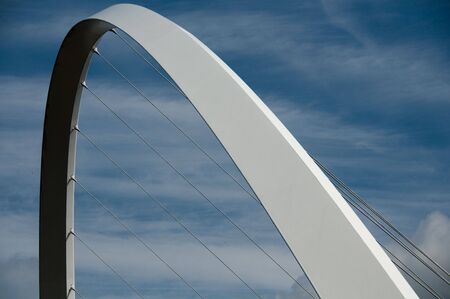 newcastle gateshead millenium bridge span with blue skiesの写真素材