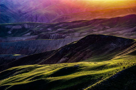 The grasslands in Karajun, Xinjiang are called air grasslands. A piece of land art composed of these curved hills.の写真素材
