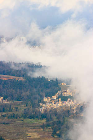 Ailao Mountain, Honghe River, Yunnan, a village in the mistの写真素材