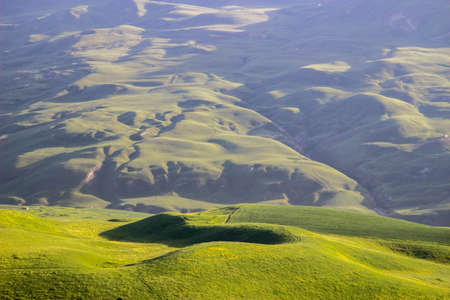 The Kalajun Grassland is located in Turks, Ili, Xinjiang, with a large area of gentle slopes forming a beautifully curved grassland.の写真素材