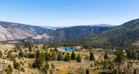 Yellowstone National Park, Wyoming, United States September 20, 2014 â A small lake nestled in the Yellowstone Park landscape.のeditorial素材