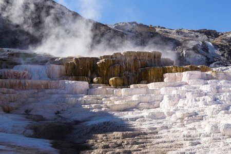 Yellowstone National Park, Wyoming, United States September 20, 2014 â Geothermal activity in Yellowstone carving interesting patterns in the rock and steam rising from the heat.のeditorial素材