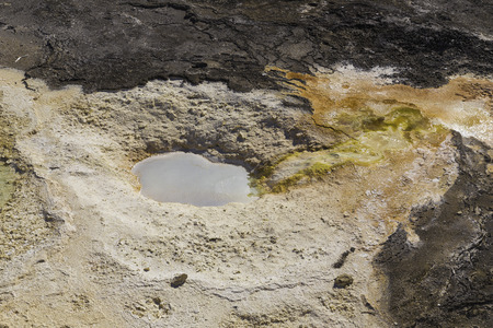Yellowstone National Park, Wyoming, United States September 20, 2014 ? Geothermal activity in Yellowstone carving interesting patterns in the rock and steam rising from the heat.のeditorial素材